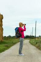 Enjoying nature with binoculars photo