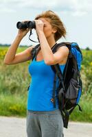 Enjoying nature with binoculars photo