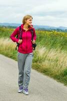 Woman hiking in nature photo