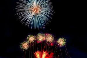 fireworks on the river in the dark sky photo