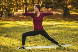 Beautiful woman doing yoga in the nature, photo