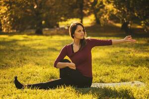 Beautiful woman doing yoga in the nature, photo