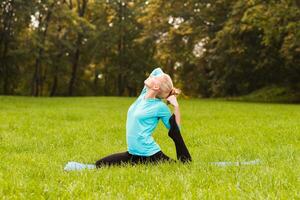 Woman doing yoga in nature photo