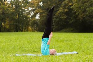 Woman doing yoga in nature photo