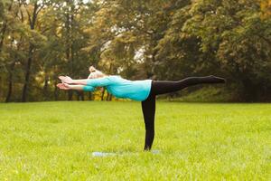 Woman doing yoga in nature photo