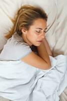 Image of happy woman sleeping photo