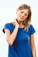 Woman having neck pain photo