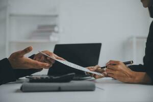 Close up view of job interview in office, focus on resume writing tips, employer reviewing good cv of prepared skilled applicant, recruiter considering application, hr manager making hiring decision photo