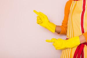 Image of  housewife  pointing at your product. photo