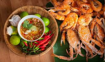 Seafood dishes such as grilled shrimp and crab and seafood sauce It consists of fresh chili, lime juice, ginger, garlic, sugar and fish sauce. A popular seafood set in Thailand. photo