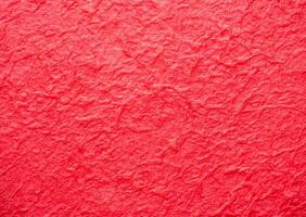 The surface of the paper is rough, crumpled, red. Rough, not smooth. use for wallpaper or background photo