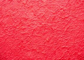 The surface of the paper is rough, crumpled, red. Rough, not smooth. use for wallpaper or background photo