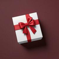 AI generated 3d render of a gift box with bow on isolated red background photo