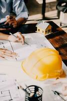 architect man working with laptop and blueprints,engineer inspection in workplace for architectural plan,sketching a construction project ,selective focus,Business concept vintage color photo