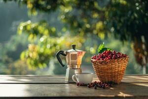 Coffee cherry beans in a basket placed on a wooden table photo