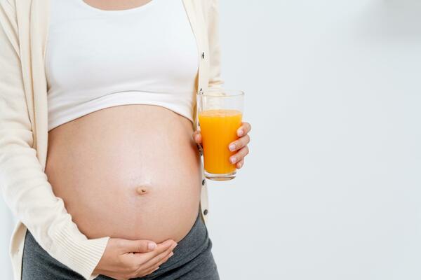 Smiling relaxed pregnant woman, future mom with tummy puts headphones on  belly for baby to listen to music. Pregnancy 24696873 Stock Photo at  Vecteezy