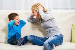 Mother and son are shouting on each other. photo