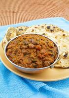 Indian Healthy Cuisine Chana Masala Also Known as Spicy Chickpeas, Channay, Chole Masala or Chholay is a Tasty, Flavourful Curry Made By Cooking Chickpeas in a Spicy Onion Tomato Masala Gravy photo