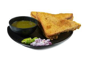 Indian Fried Snack Bread Pakora or Bread Bhaji a Common Street Food, it is Made From Bread Slices, Gram Flour, and Spices Among other Ingredients photo