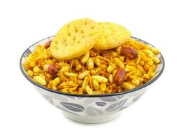 Indian Street Spicy Food Bhel puri is a savoury snack on white background photo