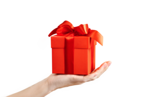 A woman's hand holds a gift with a red bow on a png background