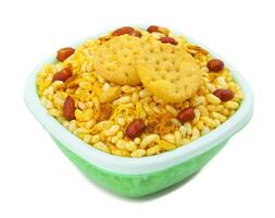 Indian Street Spicy Food Bhel puri is a savoury snack on white background photo