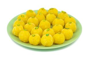 Indian Traditional Yellow Sweet Food Coconut Laddoo on White Background photo