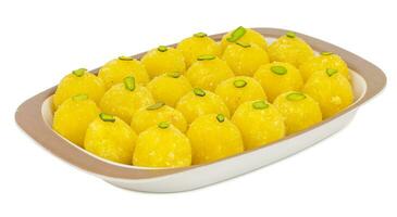 Indian Traditional Yellow Sweet Food Coconut Laddoo on White Background photo