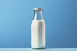 AI generated A glass bottle with full milk on blue background. AI Generated photo