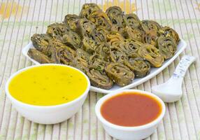 Indian Spicy Food Patra Also Called Paatra, Alu Vadi or Patrode is a Veg Dish in Maharashtra or Gujarati Cuisine. photo