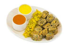 Indian Spicy Food Patra Also Called Paatra, Alu Vadi or Patrode is a Veg Dish in Maharashtra or Gujarati Cuisine. photo