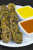 Indian Spicy Food Patra Also Called Paatra, Alu Vadi or Patrode is a Veg Dish in Maharashtra or Gujarati Cuisine. photo
