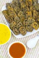 Indian Spicy Food Patra Also Called Paatra, Alu Vadi or Patrode is a Veg Dish in Maharashtra or Gujarati Cuisine. photo