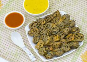 Indian Spicy Food Patra Also Called Paatra, Alu Vadi or Patrode is a Veg Dish in Maharashtra or Gujarati Cuisine. photo