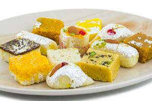 Indian Delicious Mix Sweet Food or Mix Mithai on White Background photo