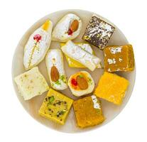 Indian Delicious Mix Sweet Food or Mix Mithai on White Background photo