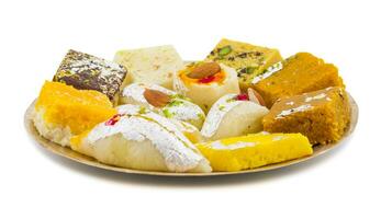 Indian Delicious Mix Sweet Food or Mix Mithai on White Background photo