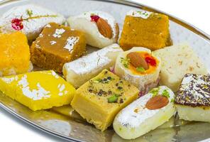 Indian Delicious Mix Sweet Food or Mix Mithai on White Background photo