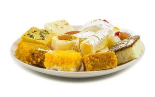 Indian Delicious Mix Sweet Food or Mix Mithai on White Background photo