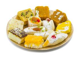 Indian Delicious Mix Sweet Food or Mix Mithai on White Background photo