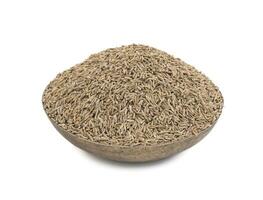 Pile of Dried Cumin Seeds on white Background photo