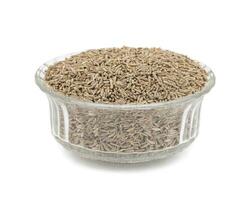 Pile of Dried Cumin Seeds on white Background photo