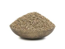 Pile of Dried Cumin Seeds on white Background photo