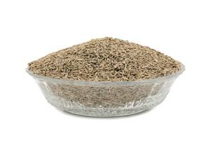 Pile of Dried Cumin Seeds on white Background photo