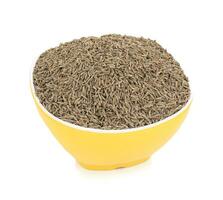 Pile of Dried Cumin Seeds on white Background photo