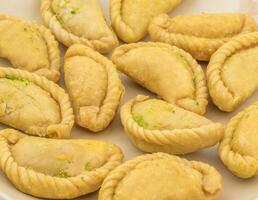 Gujiya or Gujia is a indian sweet food photo