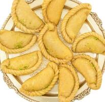 Gujiya or Gujia is a indian sweet food photo