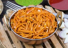 Spicy Fried Vegetable Veg Chow Mein on Wooden Table photo