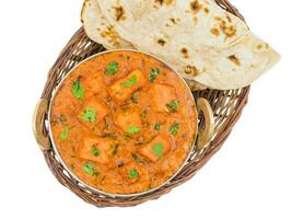 Indian Delicious Cuisine Paneer Tikka Masala With Tandoori Chapati on White Background photo