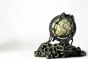 a globe is surrounded by chains and chains photo